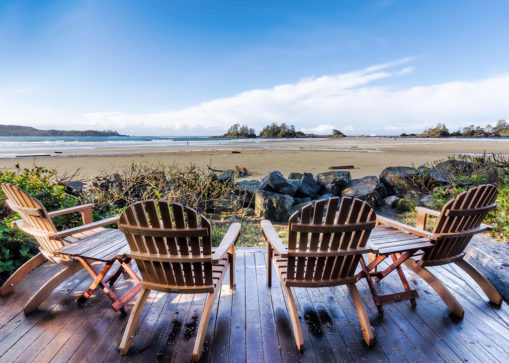 four wooden chairs on outdoor patio